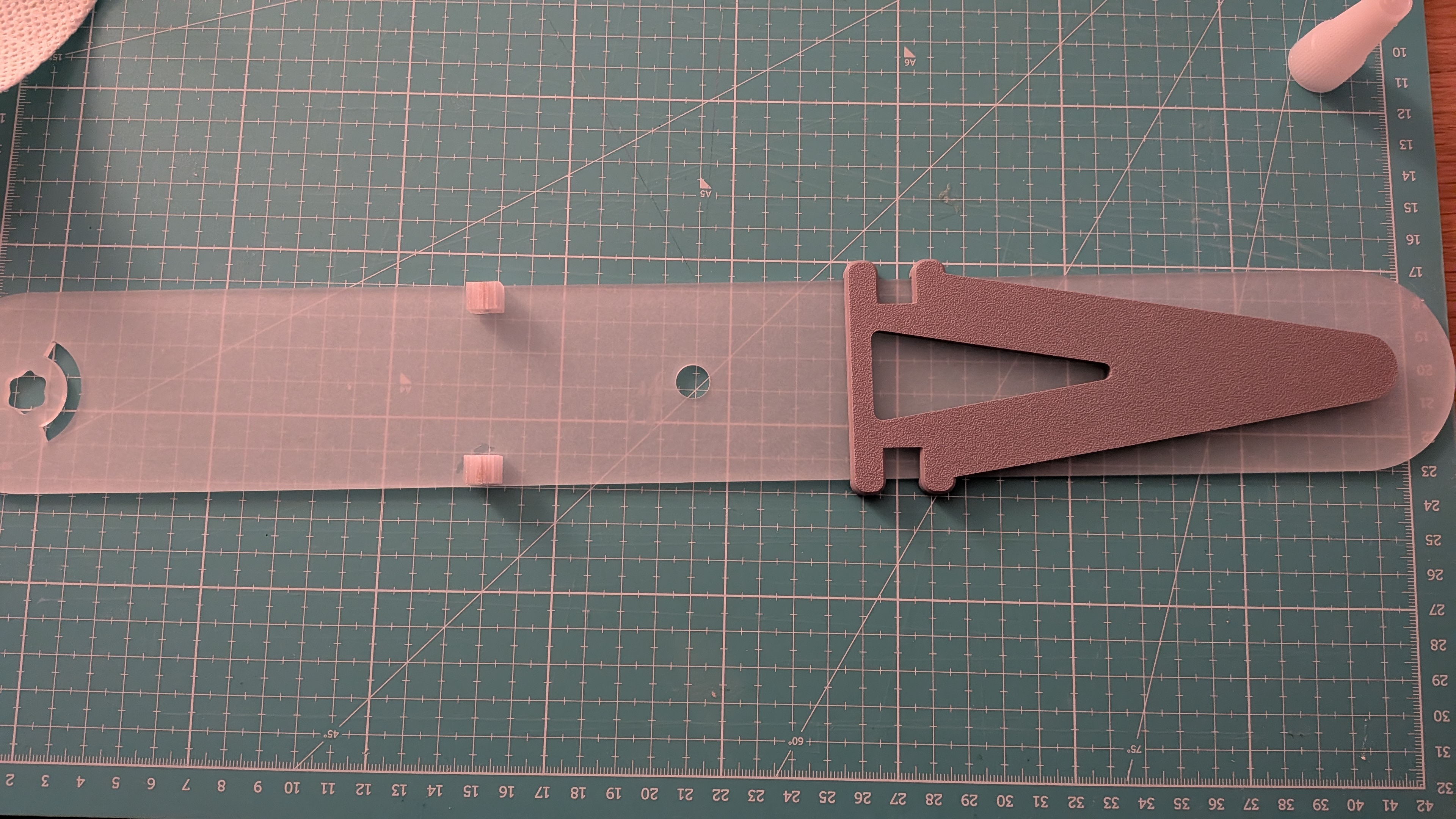Glueing the blocks with a 3D printed jig, referencing the axle hole